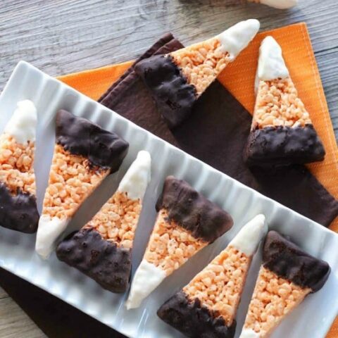 Chocolate Dipped Candy Corn Rice Krispie Treats are a fun and easy Halloween treat that the whole family will enjoy!