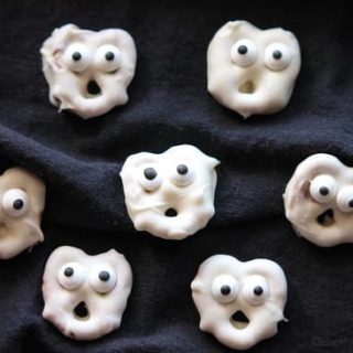 Ghost Pretzels - White chocolate dipped pretzels are made into ghosts with candy eyes and a little bit of imagination.