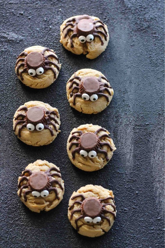 Not all Halloween food has to be gross and gory! These super cute spider cookies are made with peanut butter cups, chocolate, candy eyes, and the BEST peanut butter cookie recipe you'll ever try!