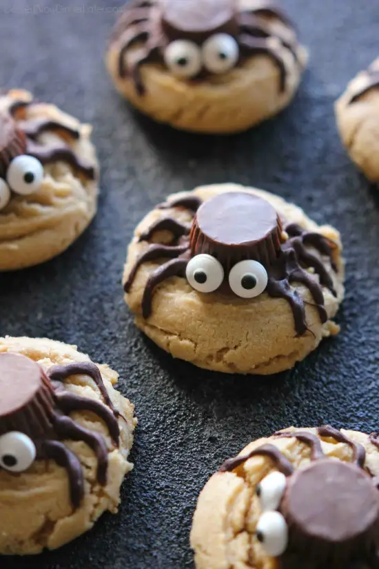 Not all Halloween food has to be gross and gory! These super cute spider cookies are made with peanut butter cups, chocolate, candy eyes, and the BEST peanut butter cookie recipe you'll ever try!