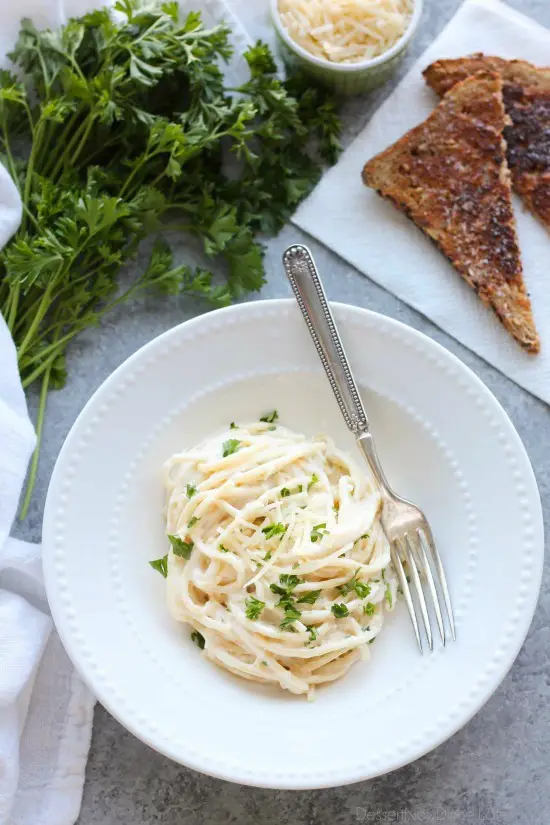 This Garlic Parmesan Spaghetti has browned butter and garlic in its thick and creamy parmesan sauce, for a super flavorful pasta dinner that will have you licking the plate clean.