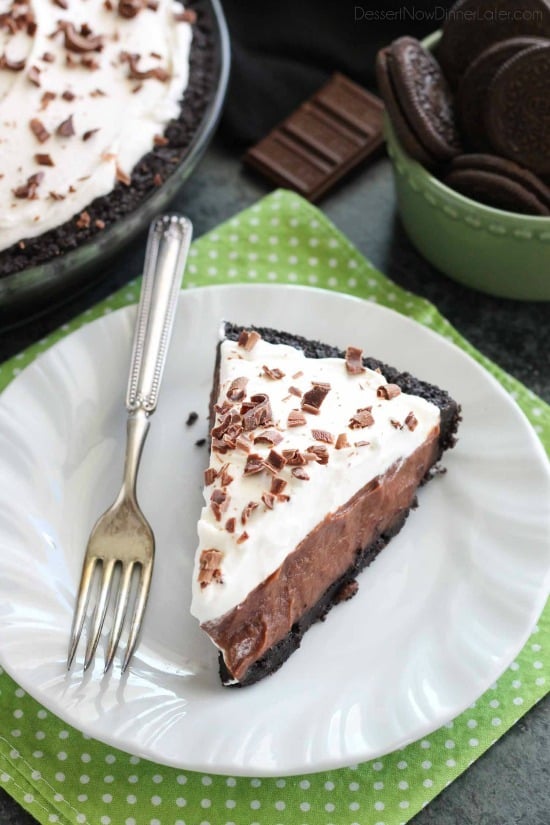 Homemade chocolate pudding topped with sweetened whipped cream, all nestled inside a chocolate cookie crust, makes the most delicious no-bake Chocolate Pudding Pie.