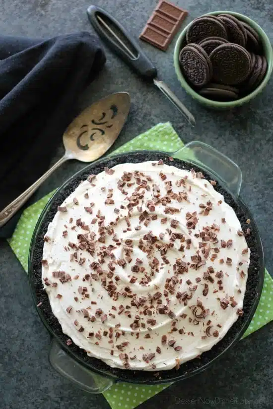 Homemade chocolate pudding topped with sweetened whipped cream, all nestled inside a chocolate cookie crust, makes the most delicious no-bake Chocolate Pudding Pie.