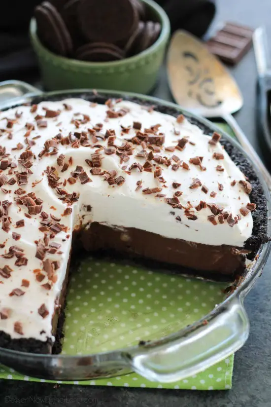 Homemade chocolate pudding topped with sweetened whipped cream, all nestled inside a chocolate cookie crust, makes the most delicious no-bake Chocolate Pudding Pie.