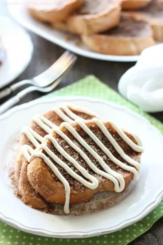 Churro French Toast - Thick slices of French bread are battered and pan fried, then dipped in cinnamon-sugar, and topped with a buttery cream cheese frosting. Delicious!