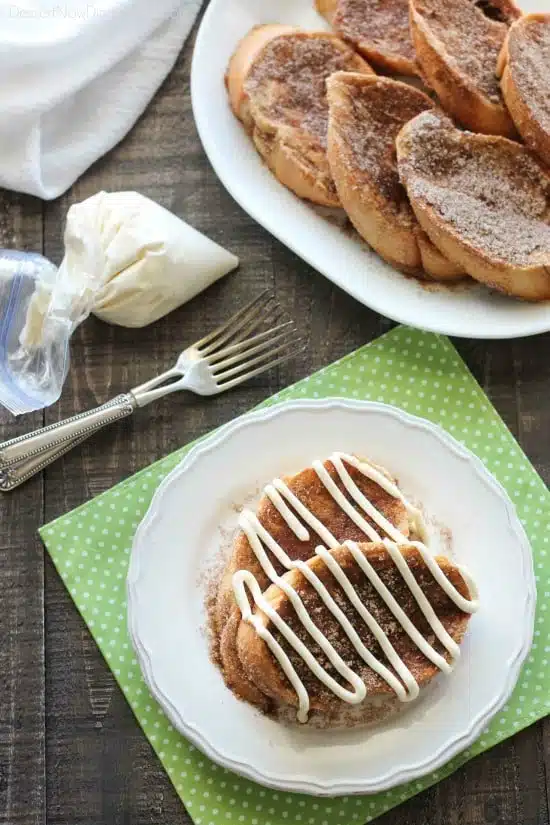 Churro French Toast - Thick slices of French bread are battered and pan fried, then dipped in cinnamon-sugar, and topped with a buttery cream cheese frosting. Delicious!