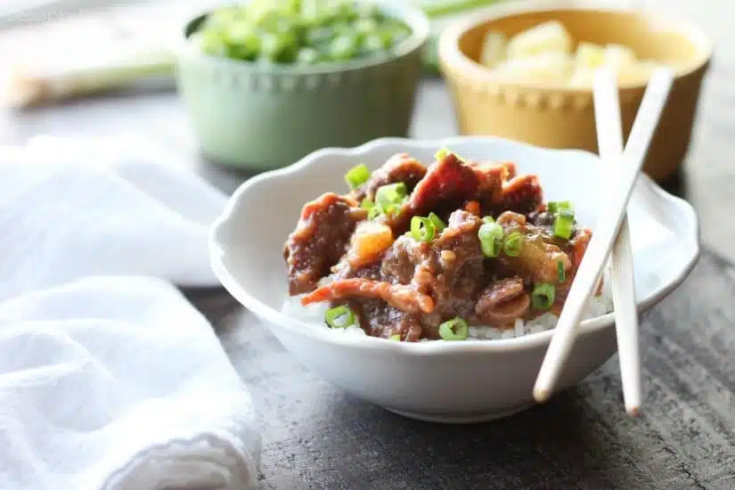 This Slow Cooker Mongolian Beef & Pineapple is a little spicy, a little sweet, full of authentic Asian flavors, and is so easy to make!