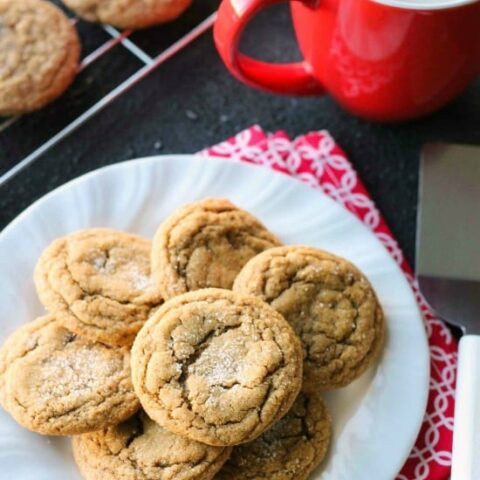 These Soft Baked Gingersnap Cookies are thick and chewy, and full of rich molasses, ginger, and spices for a wonderful Christmas cookie everyone will love!