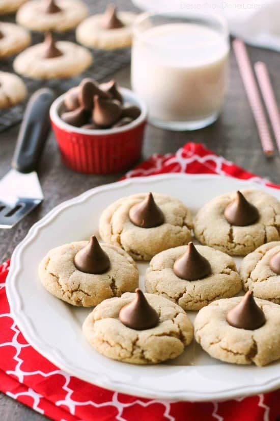 Peanut Butter Blossoms, Peanut Butter Kiss Cookies, and Peanut Butter Thumbprints are all one and the same. An easy and delicious soft peanut butter cookie with a large chocolate morsel center. Makes a great Christmas cookie to share with family and friends!