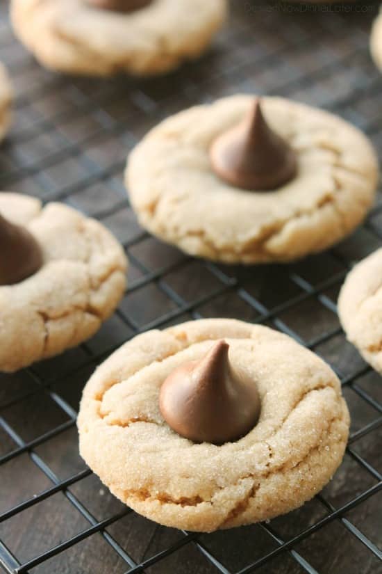 Peanut Butter Blossoms, Peanut Butter Kiss Cookies, and Peanut Butter Thumbprints are all one and the same. An easy and delicious soft peanut butter cookie with a large chocolate morsel center. Makes a great Christmas cookie to share with family and friends!