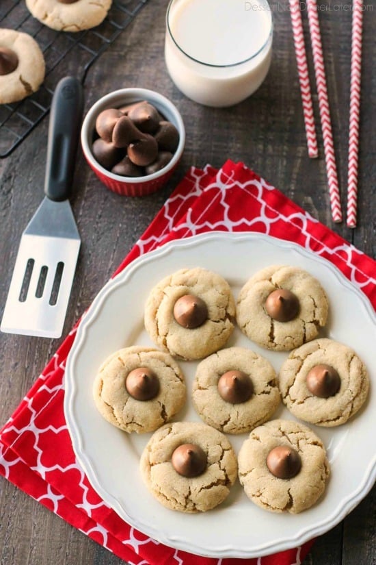 Peanut Butter Blossoms, Peanut Butter Kiss Cookies, and Peanut Butter Thumbprints are all one and the same. An easy and delicious soft peanut butter cookie with a large chocolate morsel center. Makes a great Christmas cookie to share with family and friends!