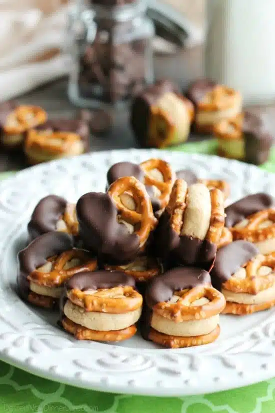 Peanut Butter Balls are made into pretzel bites for a salty-sweet addicting treat! Perfect for parties or Christmas neighbor gifts!