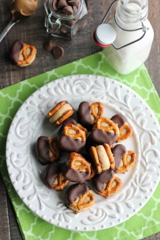 Peanut Butter Balls are made into pretzel bites for a salty-sweet addicting treat! Perfect for parties or Christmas neighbor gifts!