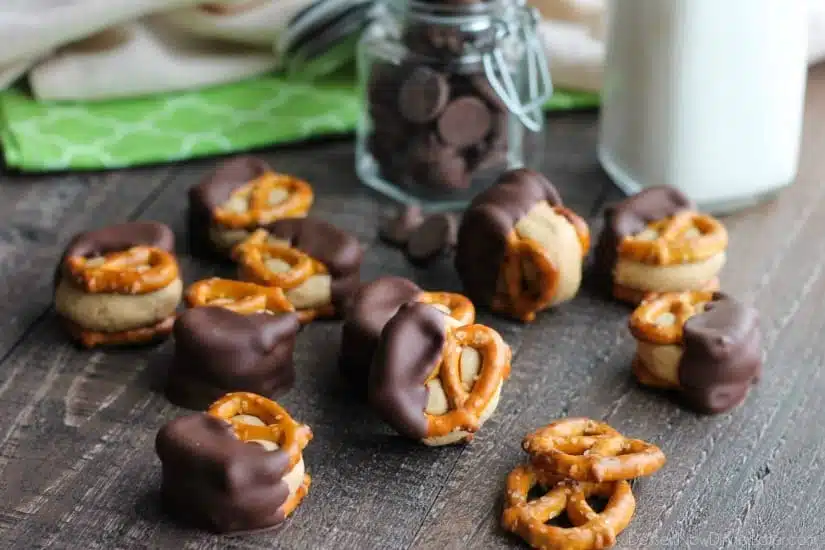 Peanut Butter Balls are made into pretzel bites for a salty-sweet addicting treat! Perfect for parties or Christmas neighbor gifts!