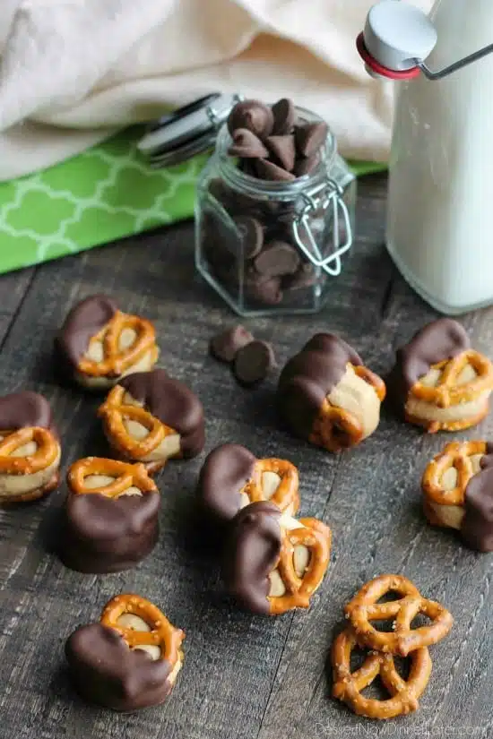 Peanut Butter Balls are made into pretzel bites for a salty-sweet addicting treat! Perfect for parties or Christmas neighbor gifts!