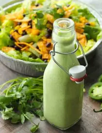 This Cafe Rio Style Cilantro Ranch Dressing is tangy, super creamy, and has a just the right kick of jalapeño. You'll want to put it on everything!