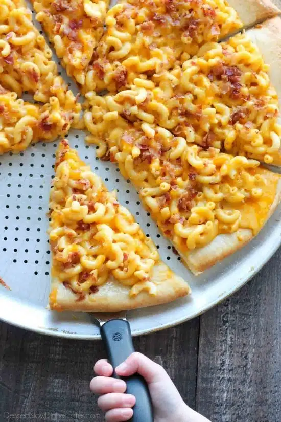 Mac and Cheese Pizza combines two tasty dinners into one incredible meal. It's so easy, the kids can make it! Top it with bacon for extra deliciousness!