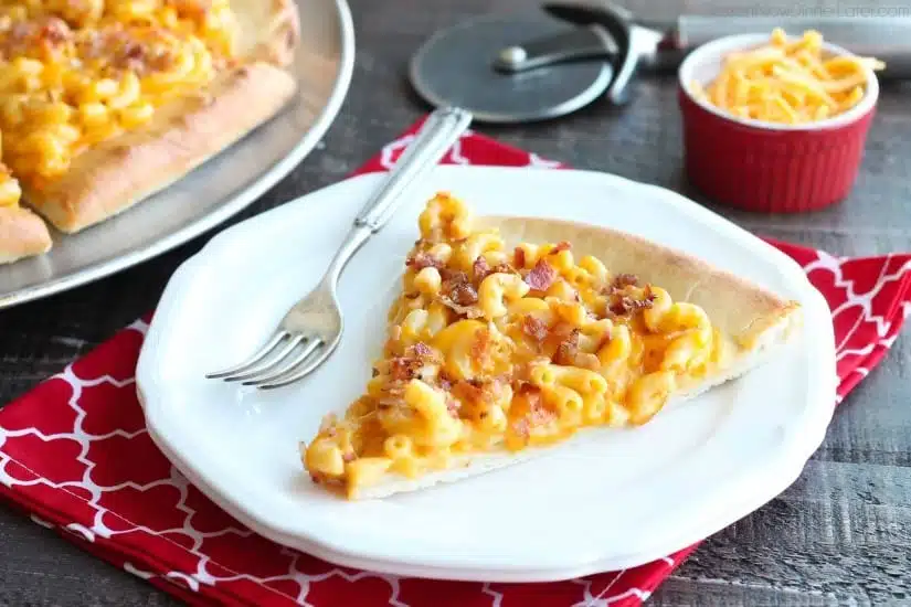 Mac and Cheese Pizza combines two tasty dinners into one incredible meal. It's so easy, the kids can make it! Top it with bacon for extra deliciousness!