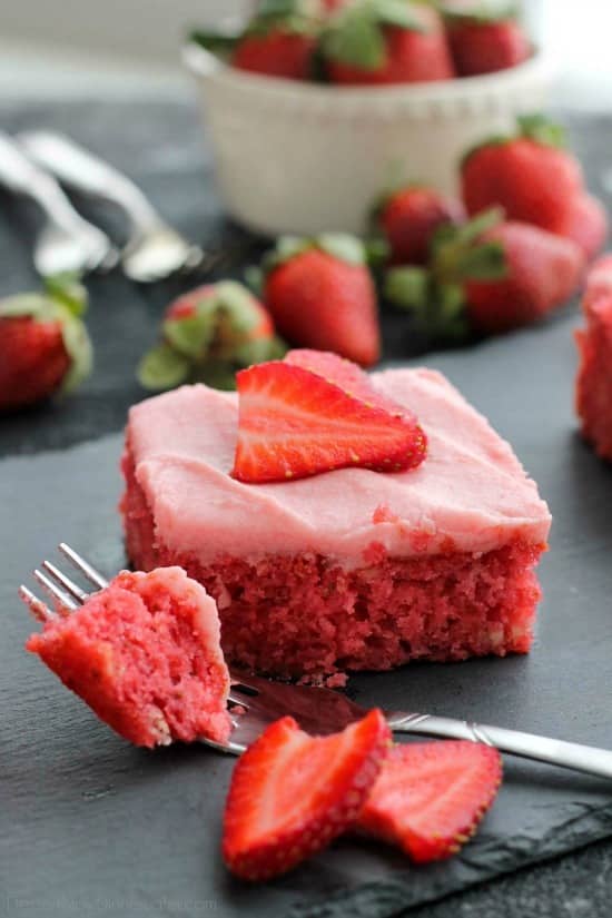 This strawberry cake uses fresh strawberries and flavored gelatin for a super flavorful strawberry sheet cake that will feed a crowd. It's really easy, and incredibly moist too!