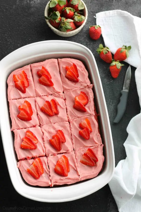 This strawberry cake uses fresh strawberries and flavored gelatin for a super flavorful strawberry sheet cake that will feed a crowd. It's really easy, and incredibly moist too!