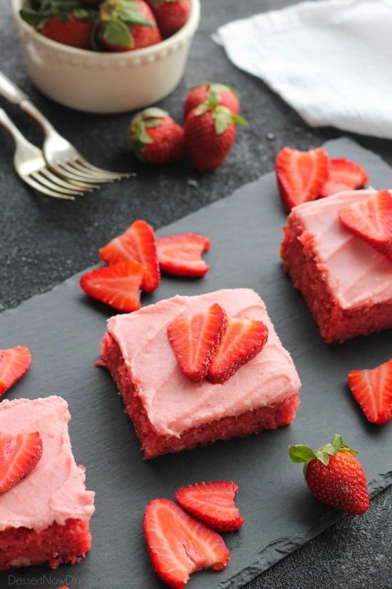 This strawberry cake uses fresh strawberries and flavored gelatin for a super flavorful strawberry sheet cake that will feed a crowd. It's really easy, and incredibly moist too!