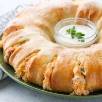 This Bacon Chicken Ranch Sandwich Ring makes a great dinner or party appetizer! It's meaty, cheesy, and full of flavor!