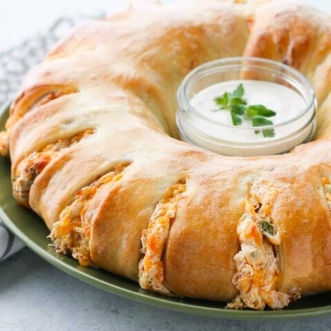 This Bacon Chicken Ranch Sandwich Ring makes a great dinner or party appetizer! It's meaty, cheesy, and full of flavor!