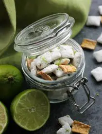 Key Lime Muddy Buddies are inspired by the flavors of a classic key lime pie. They're tangy and sweet, with graham cracker cereal pieces throughout. Perfect for parties or movie night snacking!