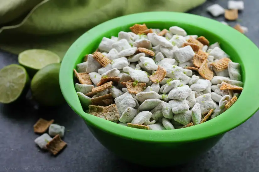 Key Lime Muddy Buddies are inspired by the flavors of a classic key lime pie. They're tangy and sweet, with graham cracker cereal pieces throughout. Perfect for parties or movie night snacking!