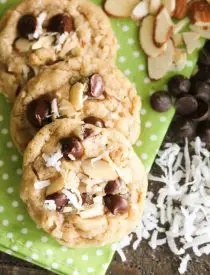 Almond Coconut Chocolate Chip Cookies are loaded with sliced almonds, shredded coconut, chocolate chips and flavored extracts for an Almond Joy inspired twist on the traditional chocolate chip cookie.