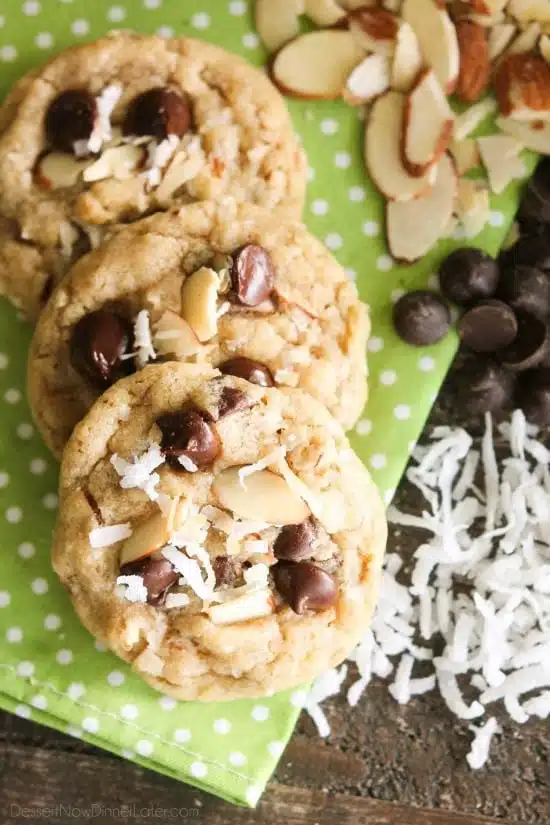 Almond Coconut Chocolate Chip Cookies are loaded with sliced almonds, shredded coconut, chocolate chips and flavored extracts for an Almond Joy inspired twist on the traditional chocolate chip cookie.