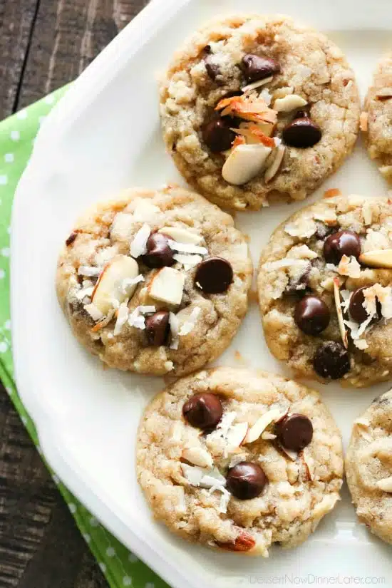 Almond Coconut Chocolate Chip Cookies are loaded with sliced almonds, shredded coconut, chocolate chips and flavored extracts for an Almond Joy inspired twist on the traditional chocolate chip cookie.