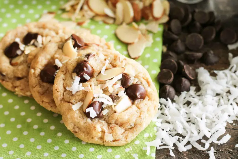 Almond Coconut Chocolate Chip Cookies are loaded with sliced almonds, shredded coconut, chocolate chips and flavored extracts for an Almond Joy inspired twist on the traditional chocolate chip cookie.