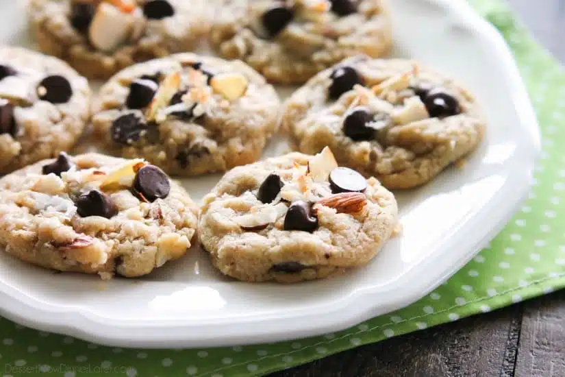 Almond Coconut Chocolate Chip Cookies are loaded with sliced almonds, shredded coconut, chocolate chips and flavored extracts for an Almond Joy inspired twist on the traditional chocolate chip cookie.