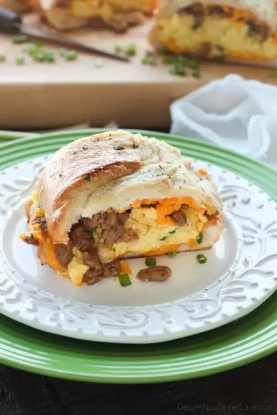 This Breakfast Stuffed French Bread is like a huge breakfast sandwich stuffed with soft scrambled eggs, meaty sausage, and sharp cheddar cheese inside a fresh baked loaf of French bread. (Substitute your favorite meats or cheeses to create your own!)