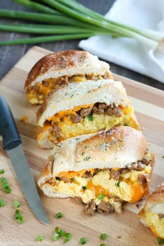 This Breakfast Stuffed French Bread is like a huge breakfast sandwich stuffed with soft scrambled eggs, meaty sausage, and sharp cheddar cheese inside a fresh baked loaf of French bread. (Substitute your favorite meats or cheeses to create your own!)