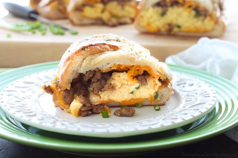 This Breakfast Stuffed French Bread is like a huge breakfast sandwich stuffed with soft scrambled eggs, meaty sausage, and sharp cheddar cheese inside a fresh baked loaf of French bread. (Substitute your favorite meats or cheeses to create your own!)