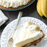 This Caramel Banana Cream Pie is heavenly and so easy to make! With caramel and freshly sliced bananas on the bottom of a homemade graham cracker crust, and a rich, creamy pudding layer on top, this banana cream pie is sure to be your new favorite dessert!