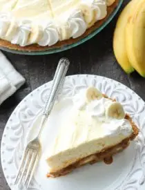 This Caramel Banana Cream Pie is heavenly and so easy to make! With caramel and freshly sliced bananas on the bottom of a homemade graham cracker crust, and a rich, creamy pudding layer on top, this banana cream pie is sure to be your new favorite dessert!