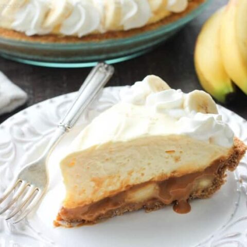 This Caramel Banana Cream Pie is heavenly and so easy to make! With caramel and freshly sliced bananas on the bottom of a homemade graham cracker crust, and a rich, creamy pudding layer on top, this banana cream pie is sure to be your new favorite dessert!