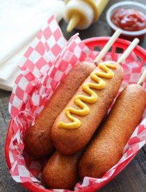 These homemade corn dogs are lightly sweet, crisp, and hand-dipped just like the ones at Corn Dog Castle in California Adventure, Disneyland. They freeze well too!