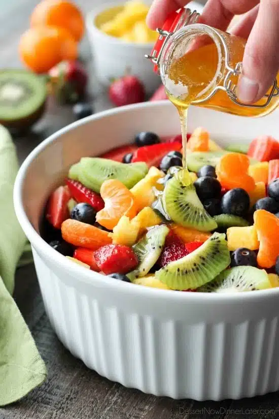 This summer fruit salad is as colorful as a rainbow, and is tossed in a reduced honey orange glaze for the perfect amount of added sweetness and flavor. Great for barbecues, potlucks, and picnics!