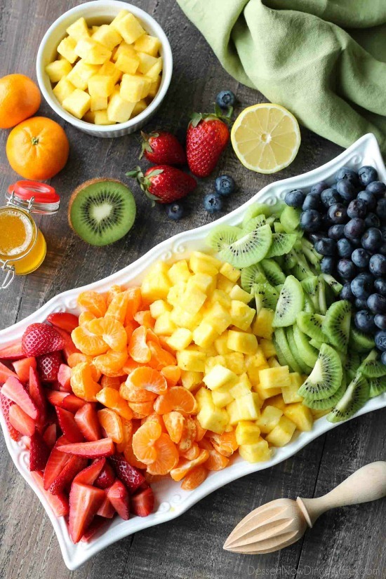 This summer fruit salad is as colorful as a rainbow, and is tossed in a reduced honey orange glaze for the perfect amount of added sweetness and flavor. Great for barbecues, potlucks, and picnics!