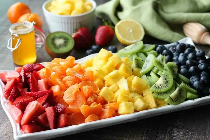 This summer fruit salad is as colorful as a rainbow, and is tossed in a reduced honey orange glaze for the perfect amount of added sweetness and flavor. Great for barbecues, potlucks, and picnics!