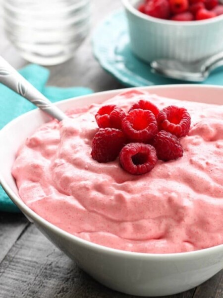 Raspberry Fluff Fruit Salad is the jello salad that everyone loves! With only 4-ingredients and 5 minutes prep, this is the perfect sweet side dish for your next potluck, picnic, or BBQ!
