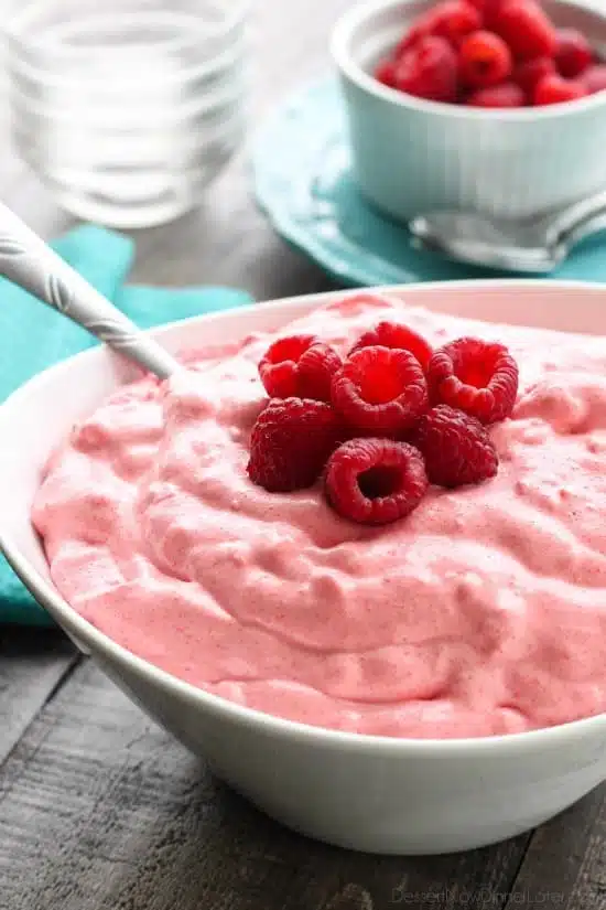 Raspberry Fluff Fruit Salad is the jello salad that everyone loves! With only 4-ingredients and 5 minutes prep, this is the perfect sweet side dish for your next potluck, picnic, or BBQ!