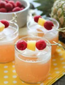 Raspberry Pineapple Punch is fruity, fizzy, and family friendly. Great for your summer party or baby shower.