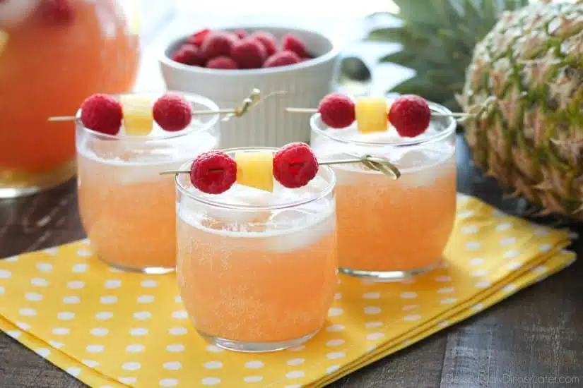 Raspberry Pineapple Punch is fruity, fizzy, and family friendly. Great for your summer party or baby shower.