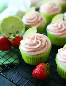 Strawberry Lime Cupcakes are perfect for summer, with a tangy lime cupcake base and sweet strawberry frosting they are sure to be loved by all. A family-friendly, non-alcoholic alternative to strawberry margarita cupcakes!