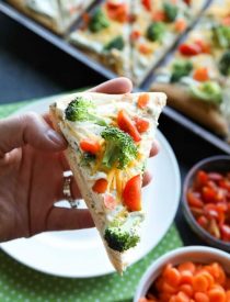 This cold vegetable pizza is the ultimate party appetizer for summer potlucks. With a fresh baked crust, creamy ranch spread, and crunchy fresh vegetables, everyone will be coming back for seconds!